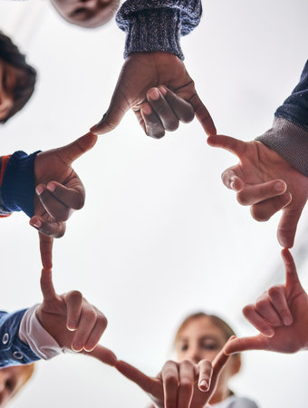We can do a lot when we are united. young kids playing together outdoors.の写真素材