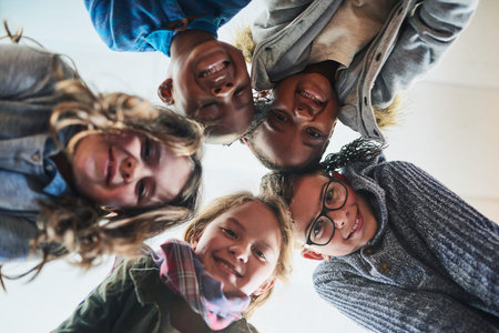 Schools the best with friends like these. Portrait of a group of elementary school kids standing in...