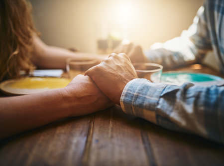 Hold my hand and we will mould our future together. an unrecognizable couple spending time together at a cafe.の写真素材