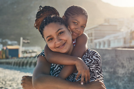 The greatest gift is our quality time together. Portrait of a mother and her little daughter enjoying some quality time together at the beach.の写真素材