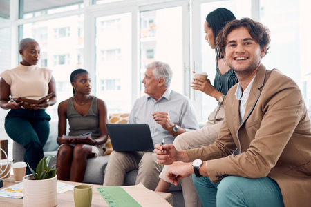 Businessman, teamwork meeting and portrait on sofa in office for creativity, marketing analysis and happy employees planning strategy. Business people, team talking and creative designer man smilingの写真素材