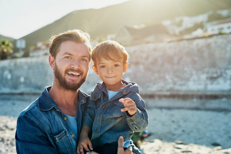 Beach bonding with my boy. a young Father and son spending quality time at the beach.の写真素材
