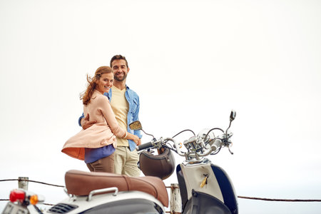 The scenery is so worth it. an adventurous couple out for a ride on a motorbike.の写真素材