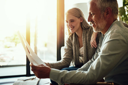 Just another day at home. a couple going through their paperwork together at home.の写真素材