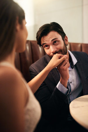 He knows how to treat a lady. a happy young couple enjoying a romantic dinner date at a restaurant.