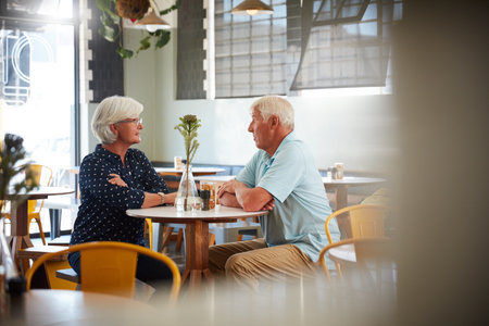 We found a great spot for out brunch dates. a senior couple sitting in a cafe.の写真素材
