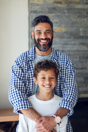 Our bond strengthens with love and care each day. Portrait of a father and son bonding together at home.の写真素材