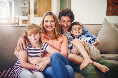 The love of a family. Portrait of a happy family bonding together at home.