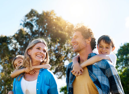 These are the moments that make family. a happy family spending time together outdoors.
