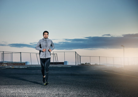 You can run at any time. a sporty young man out for a run.