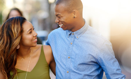 Side by side, day by day. a happy young couple taking a walk through the city.