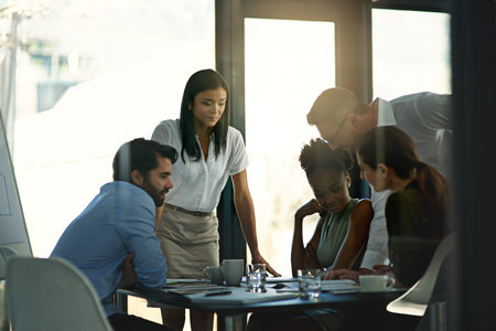 Lets have a look see...a group of businesspeople meeting in the boardroom.