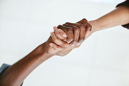 Coming together for a common cause. two people shaking hands.