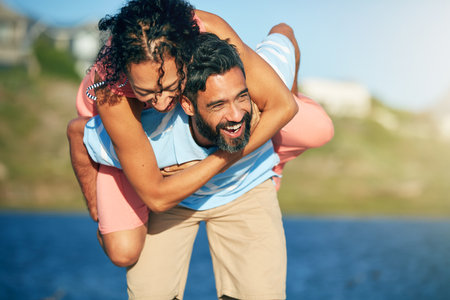 Discover the joy of play again. a loving couple spending the day at the beach.の写真素材