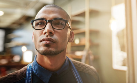 I have big dreams for my career. Closeup shot of a young entrepreneur standing in his business.