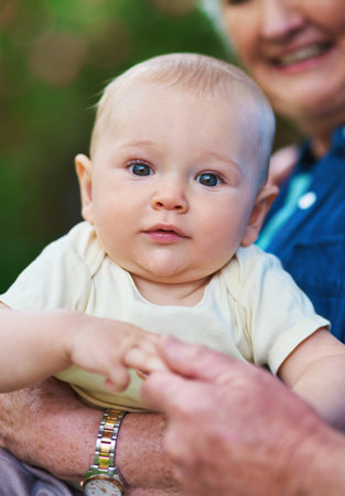 Theyre worth the time spent. a baby boy spending time outdoors with his grandmother.