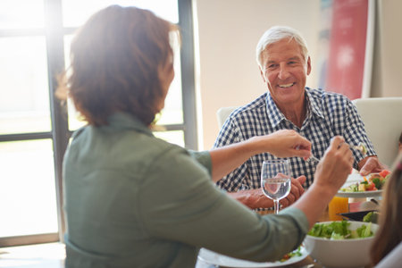 Precious bonding time with great food on the menu. a family having lunch together.の写真素材
