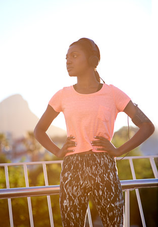 Feeling good after a solid workout. an attractive young woman exercising outdoors.の写真素材