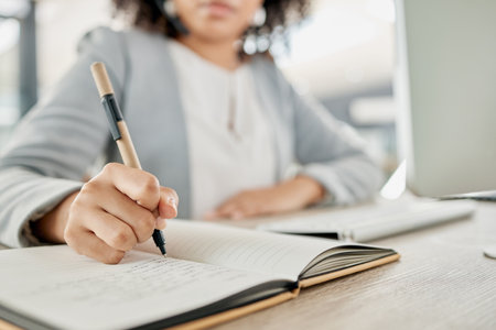 Notebook, pen and hands of woman writing, planning and working on calendar schedule for corporate business event. Paper, receptionist and secretary with pencil, planner and journal for message notesの写真素材