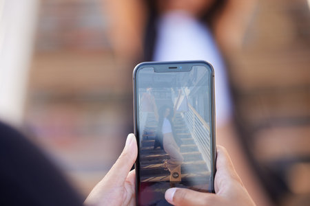 Hands, phone and picture of woman with shopping bags shopping in the city. Discount deals, sales or...
