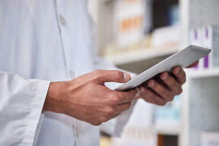 Man, hands or pharmacy digital tablet in medicine product research, healthcare wellness treatment or pills stock check. Zoom, pharmacist employee or medical worker on technology in drugs retail storeの写真素材