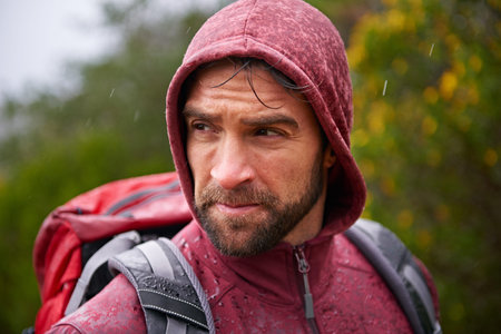 He will endure. a young man enjoying a hike through the mountains.