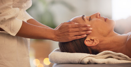 Woman, relax and hands for scalp massage in salon beauty spa for skincare wellness, stress relief and zen body care. Healing therapy, therapist and physical therapy, head or luxury facial dermatologyの写真素材