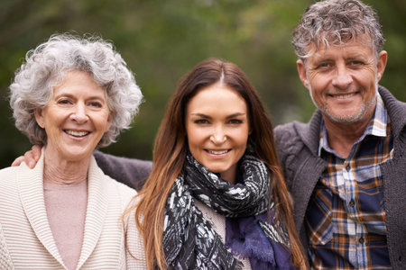 Shell always be our little girl. a beautiful woman spending time with her senior parents.