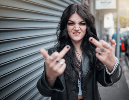 Face portrait, middle finger and woman in city with rude gesture or insult. Punk fashion, goth and...