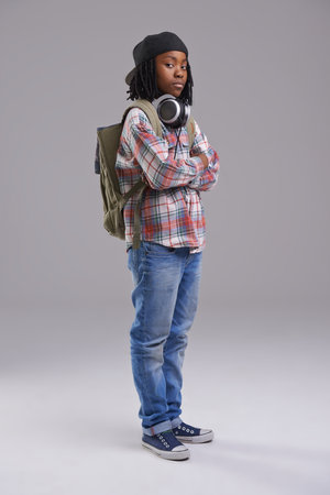 He has attitude. An African-American boy listening to music over his headphones.の写真素材