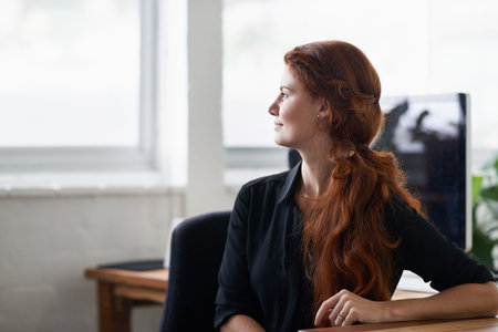 One positive thought can change the course of your day. a beautiful young businesswoman sitting at...