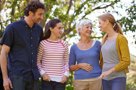 Youre always welcome at Grandmas. a multi-generational family standing together in the outdoors.の写真素材
