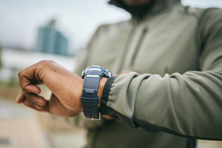 Fitness, training and hand of a man with a watch for progress, exercise monitor and tracking health...