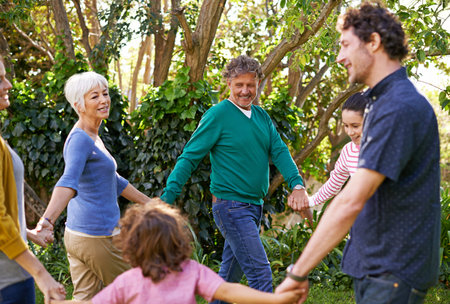Ring around the garden. a family playing together in the yard.