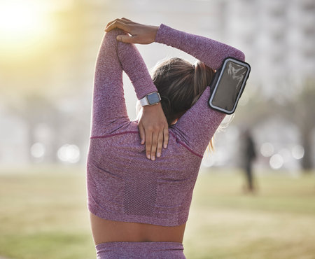 Back, woman and stretching outdoor, health and workout for wellness, fitness and training. Female,...