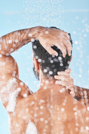 Beauty, cleaning hair and man in shower to wash with shampoo, conditioner and hair products....