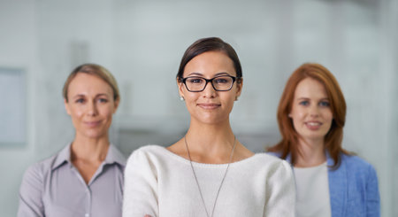 Strong women in the workplace. A cropped portrait of three business people standing in an office.の写真素材