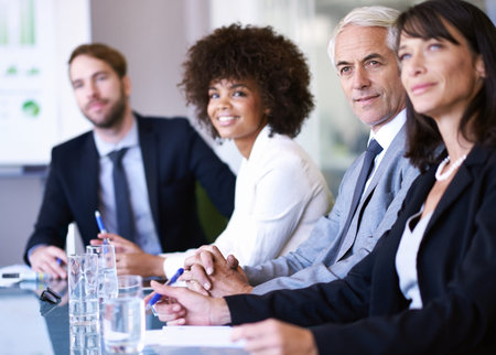 Business discussions. a group of business colleagues meeting in the boardroom.