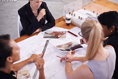 Ready for construction. A group of female architects working together on a project at a conference table.の写真素材