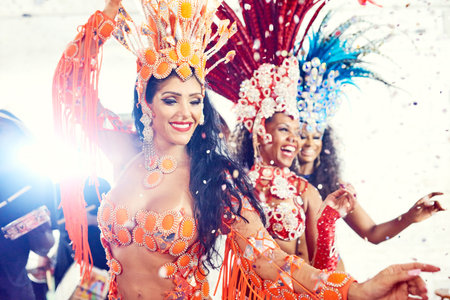 Its always a carnival in Rio. beautiful samba dancers performing at a carnival.