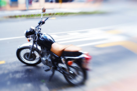 Ready to hit the road. a motorbike parked on the side of a road.