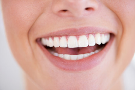 With teeth like these there is no excuse not to smile. Close up of a womans sparkling teeth.の写真素材