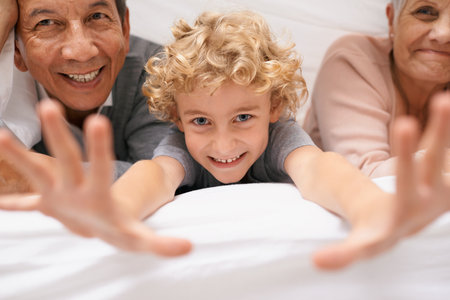 Its always fun at granny and gramps. A young boy having fun with his grandparents.の写真素材