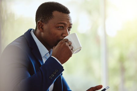 Businessman, travel or drinking coffee on phone in airport lounge, hotel lobby or modern office building. Corporate worker, employee or manager with tea, technology innovation vision or company ideasの写真素材