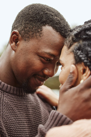 Black couple, forehead and smile for love, embrace or happy relationship bonding together in the...