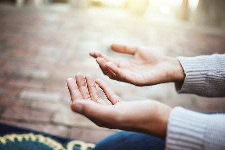 Hands, praying and religion with a man muslim prayer to God in faith or devotion in islamic worship...