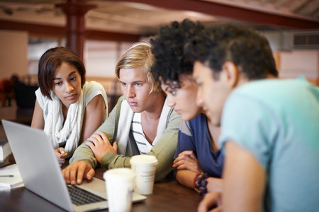 Working together to prepare for finals. A group of young people studying together for the upcoming...