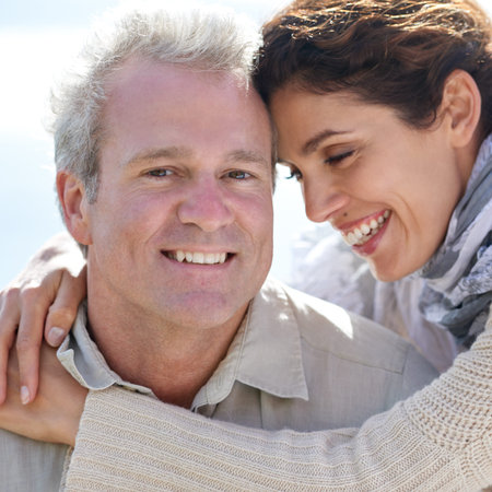 True love. A happy mature couple with their heads together affectionately.