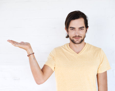 Mockup gesture, studio portrait and man with sales promotion, luxury present gift or discount deal mock up. Marketing space, product placement or advertising model isolated on white background wallの写真素材