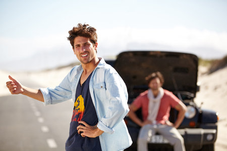 I guess well have to hitchhike. Two male friends getting frustrated at the lack of help after...
